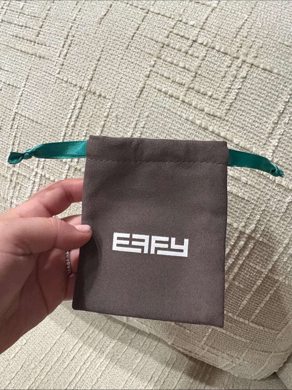 Effy brown jewelry pouch with green ribbon
